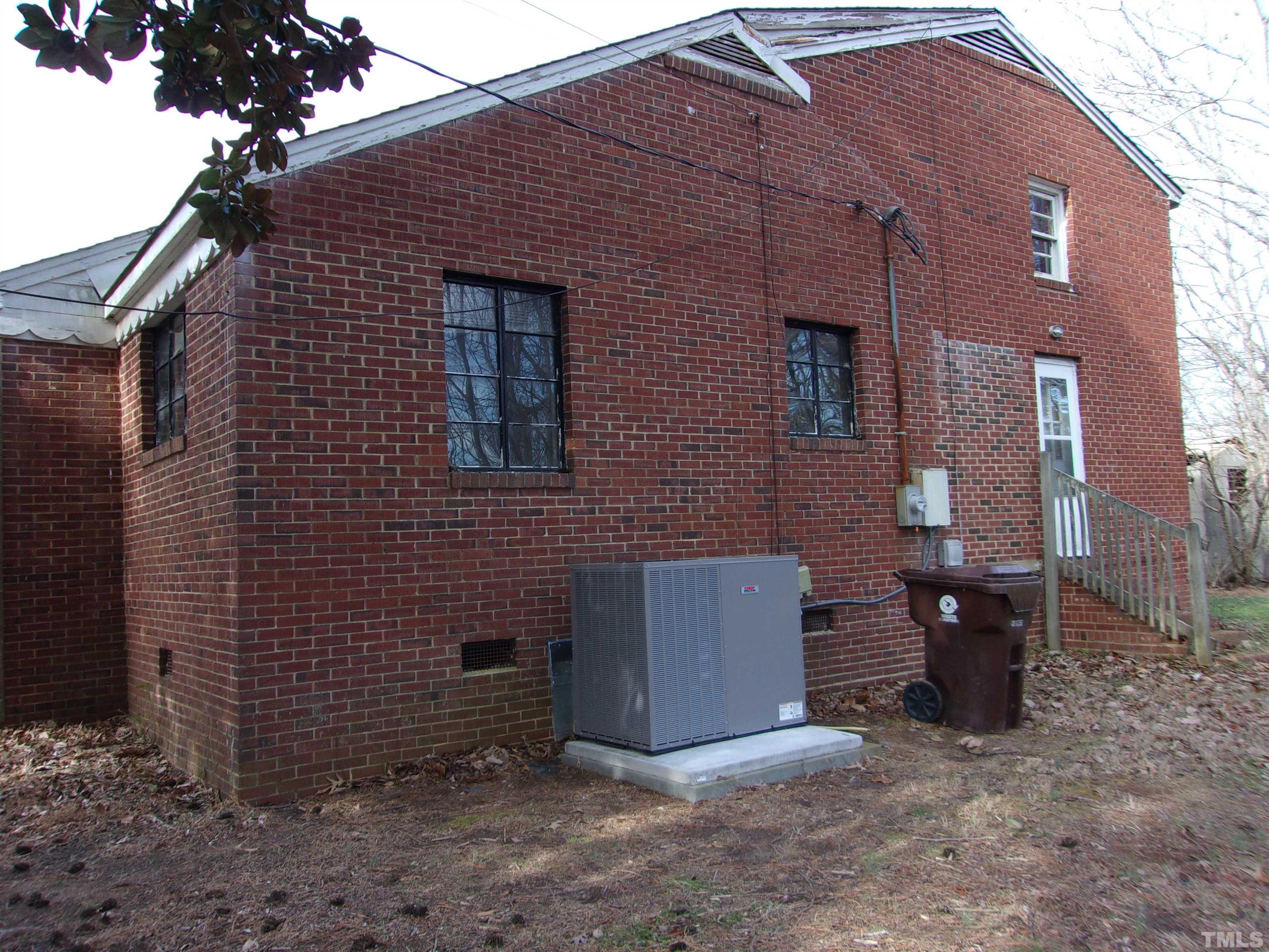 132 Trotter Street Roxboro, NC 27573 - Photo 11 of 12 a front view of a house with parking area