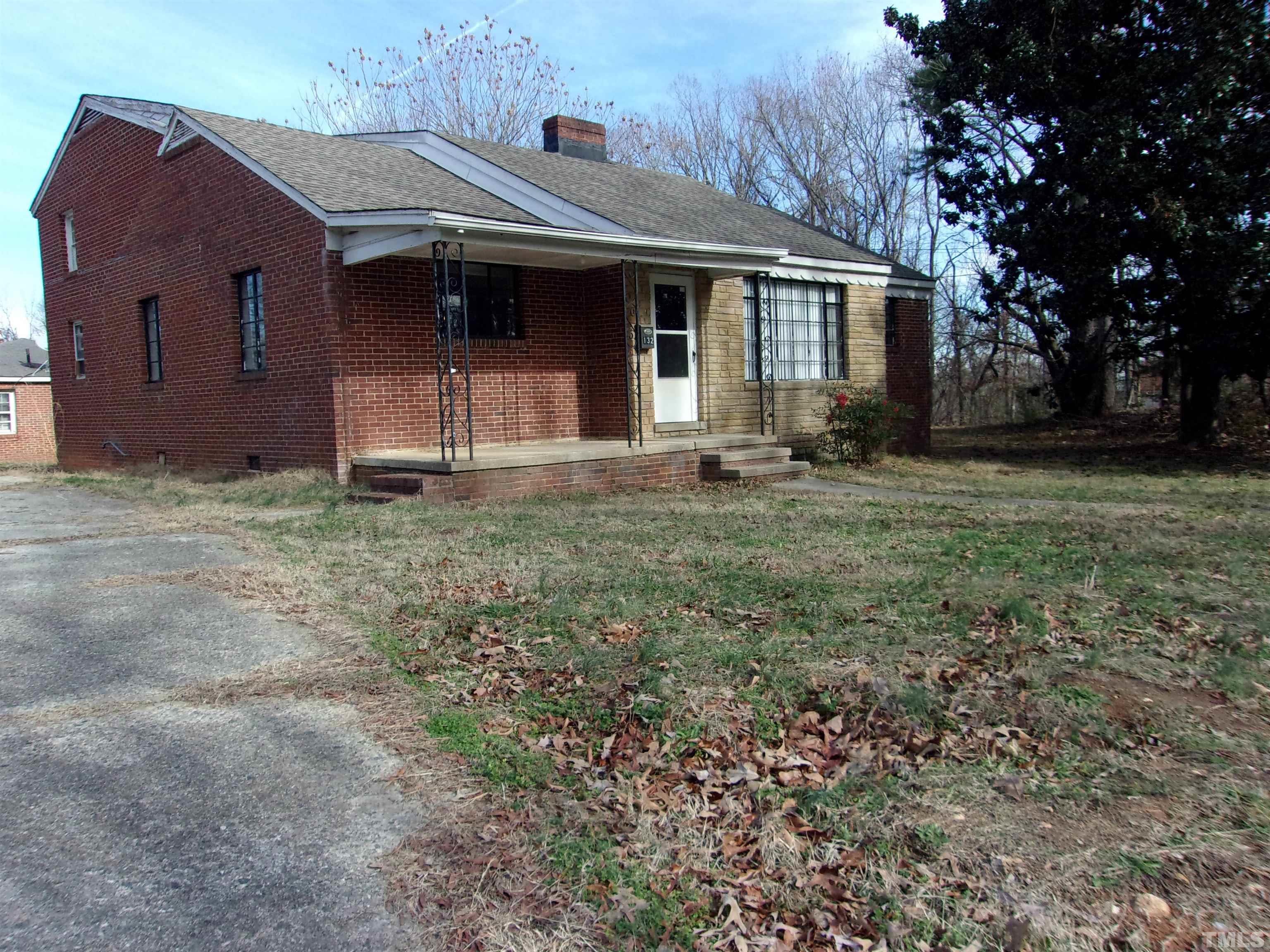 132 Trotter Street Roxboro, NC 27573 - Photo 2 of 12 a front view of a house with garden