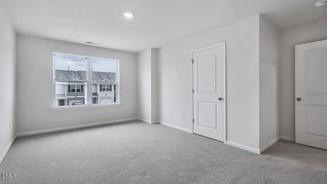 a view of an empty room and a window