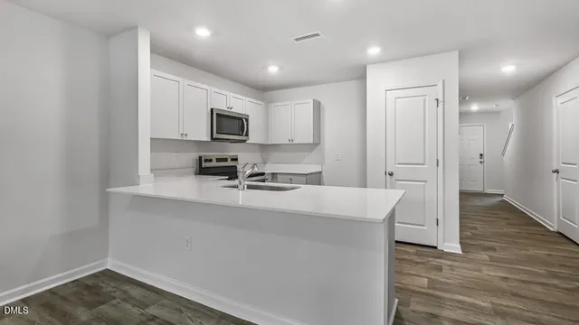 a view of kitchen with wooden floor