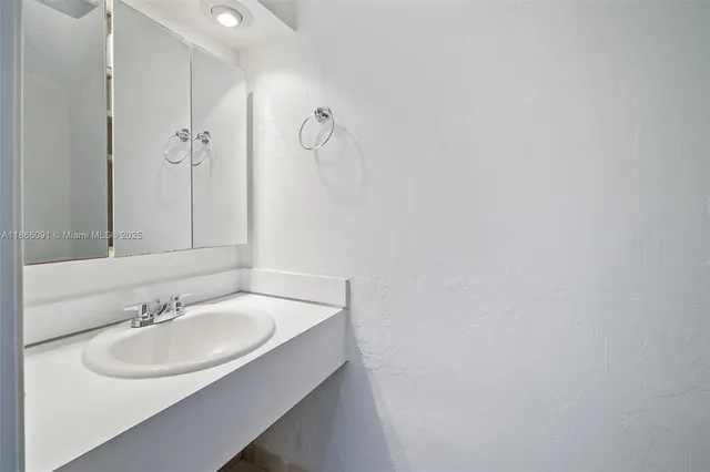 a view of an empty room with windows