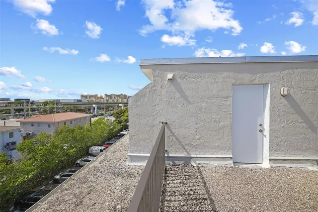a view of storage and utility room with racks on the wall