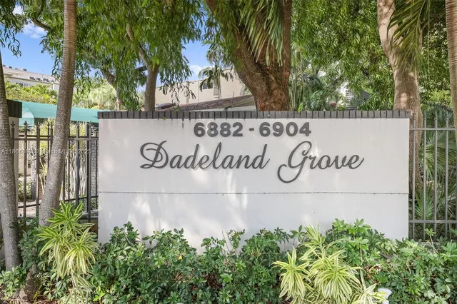 a view of an empty room and a window