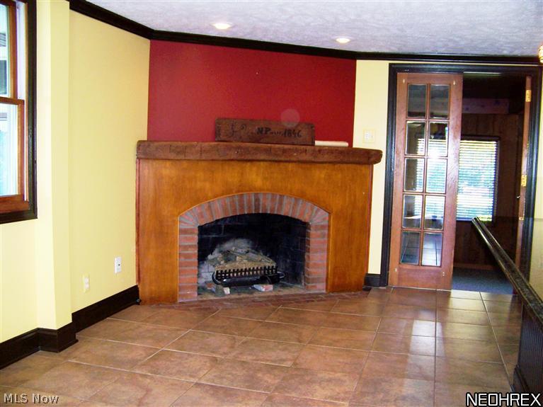 3372 Huffman Road Medina, OH 44256 - Photo 9 of 25 Kitchen fireplace - French doors to sunroom