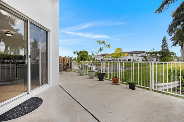 a bathroom with a sink mirror and toilet