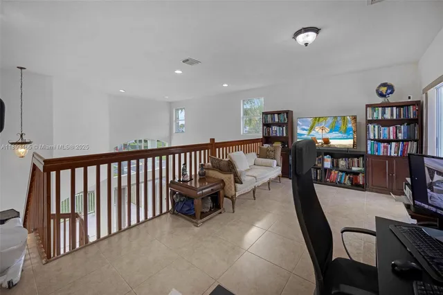 a bedroom with a bed and a chair