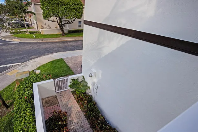 a bathroom with a sink a light fixture and a mirror