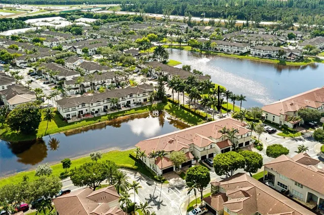 a bedroom with furniture and a large window