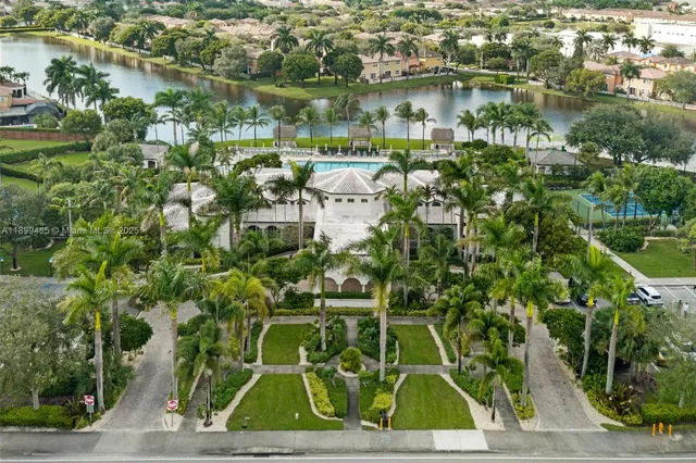 a view of swimming pool with a table and chairs