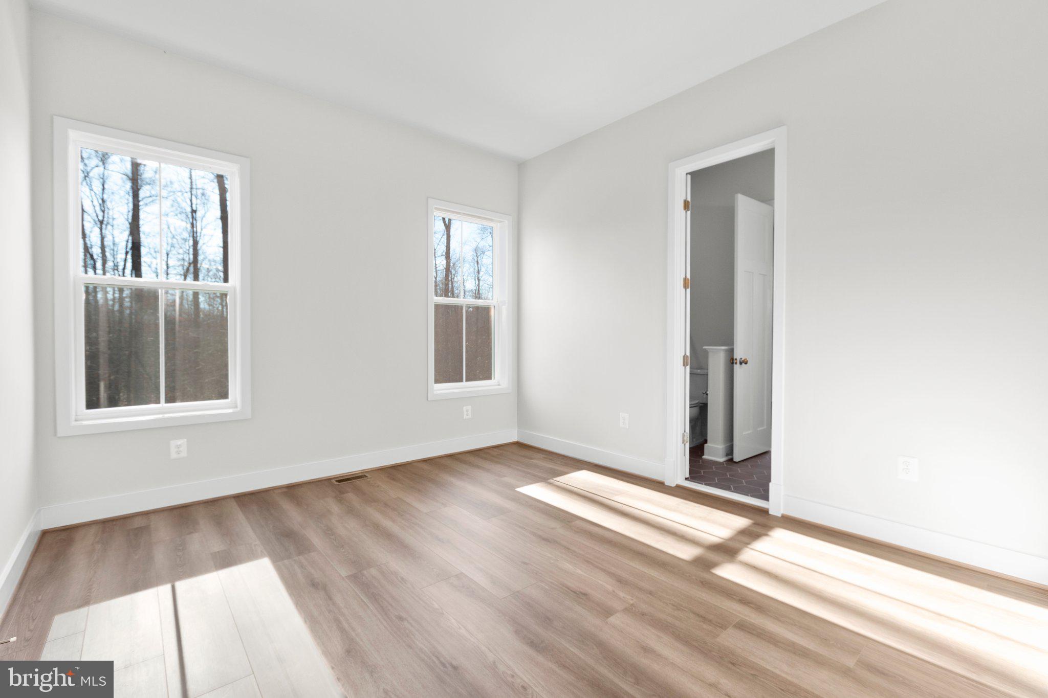 10 Burwell Road Nokesville, VA 20181 - Photo 17 of 57 an empty room with wooden floor and windows