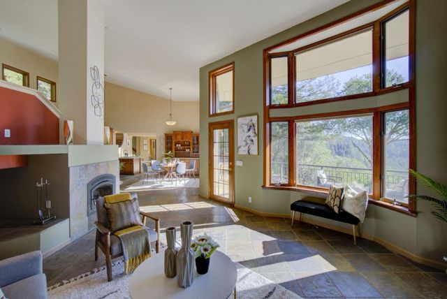 a living room with a flat screen tv and a table