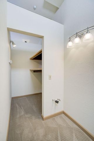 a reading room with furniture a rug and a window