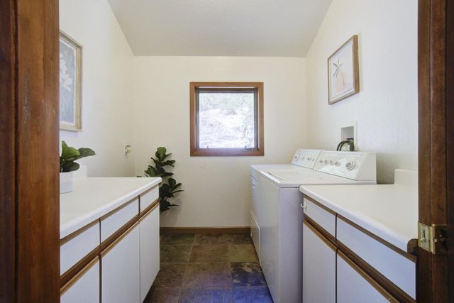 a living room with furniture and a lamp