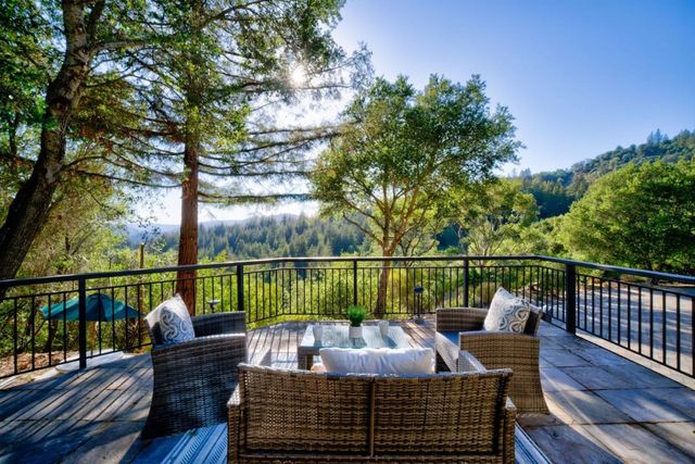 a view of balcony with furniture
