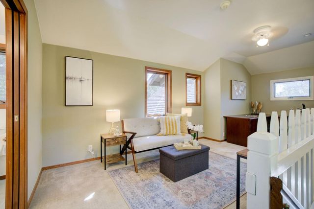 an aerial view of house with yard swimming pool and outdoor seating
