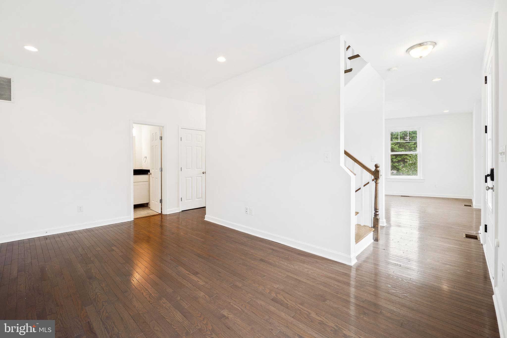 3114 19th Street South Arlington, VA 22204 - Photo 18 of 31 a view of empty room with wooden floor and fan