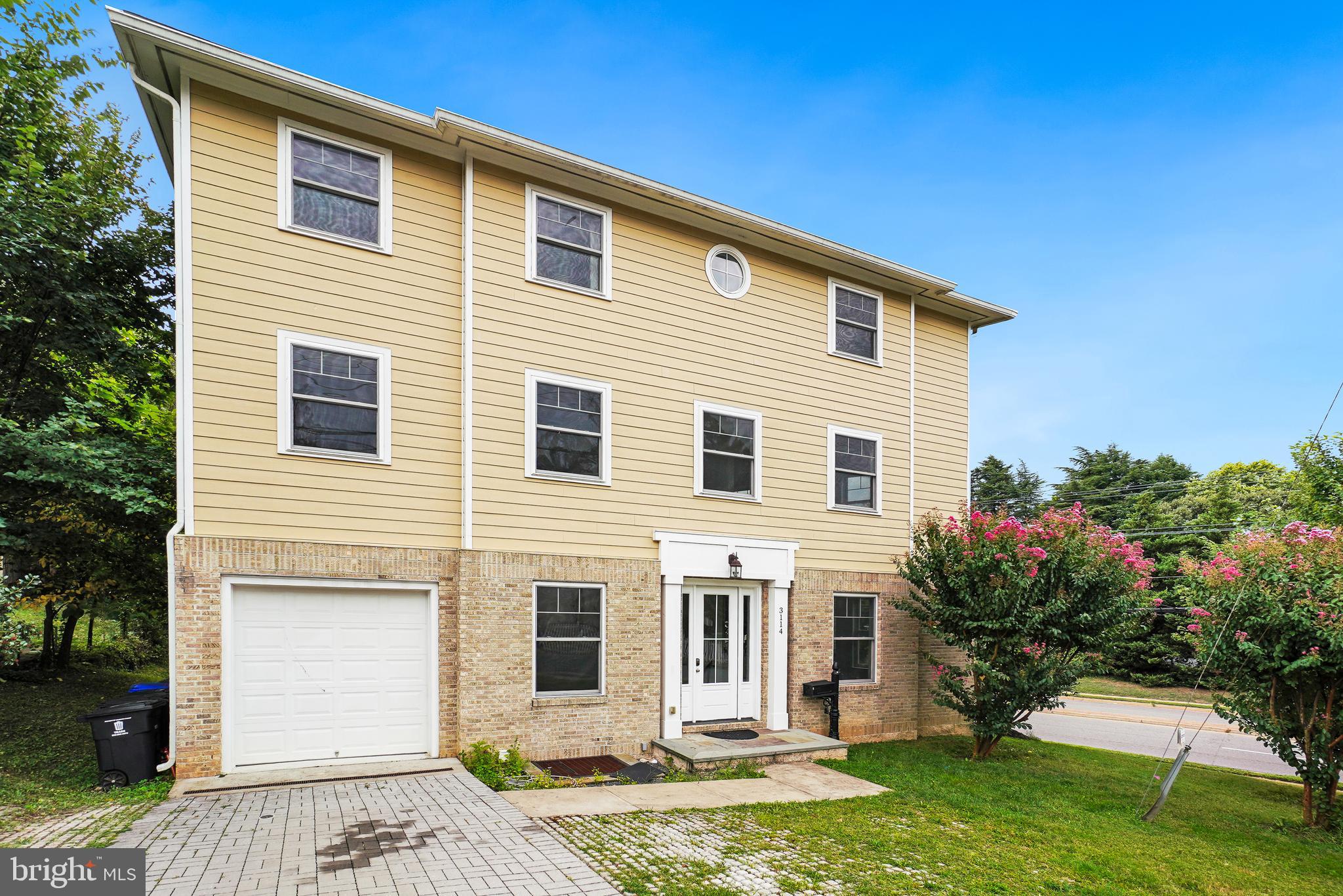 3114 19th Street South Arlington, VA 22204 - Photo 2 of 31 a front view of a house with a yard