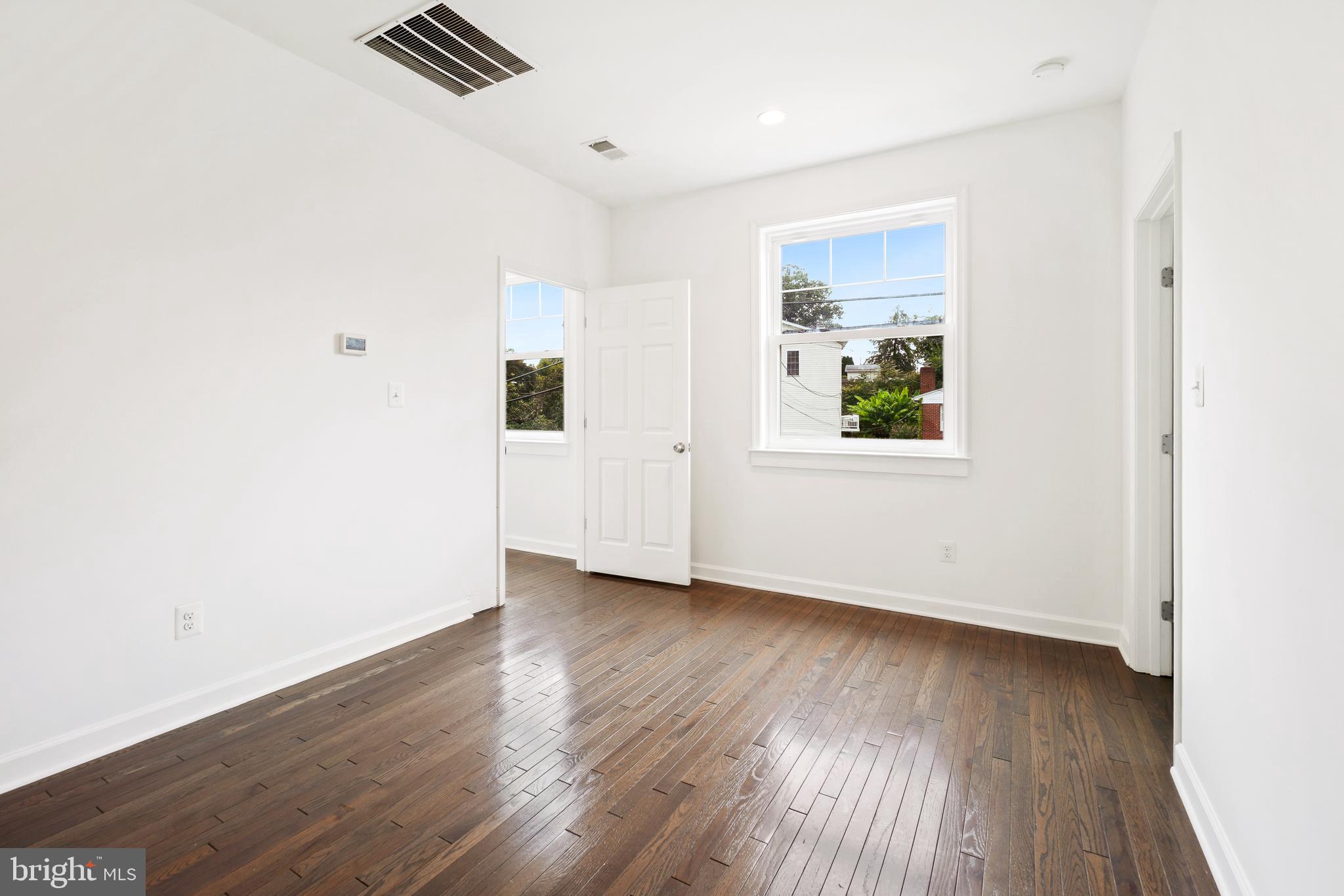 3114 19th Street South Arlington, VA 22204 - Photo 23 of 31 an empty room with wooden floor and windows