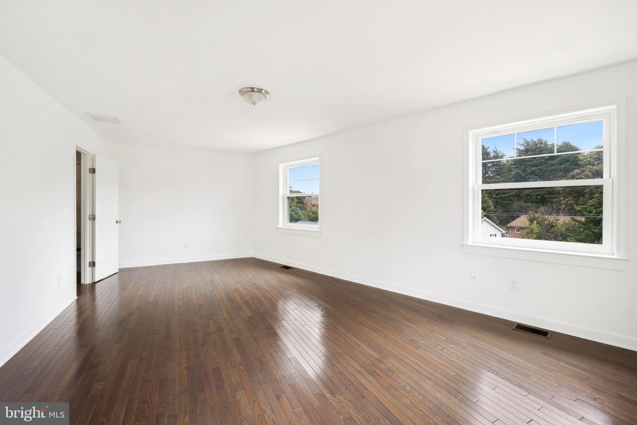 3114 19th Street South Arlington, VA 22204 - Photo 26 of 31 an empty room with wooden floor and windows