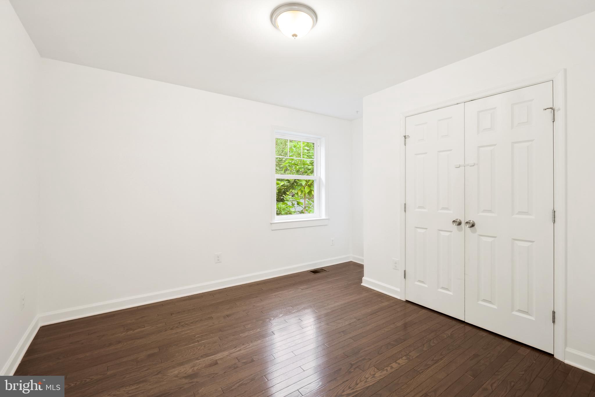 3114 19th Street South Arlington, VA 22204 - Photo 27 of 31 an empty room with wooden floor and windows