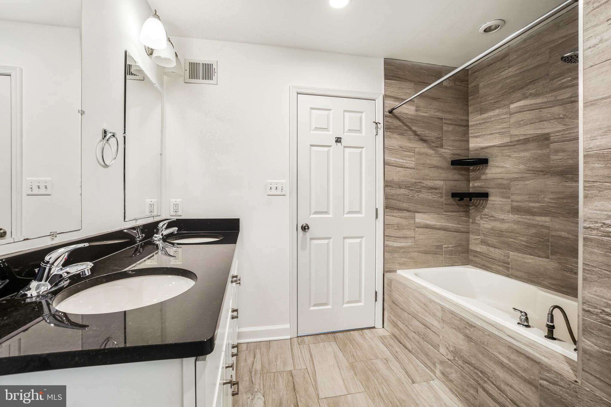 3114 19th Street South Arlington, VA 22204 - Photo 28 of 31 a bathroom with a sink and a mirror