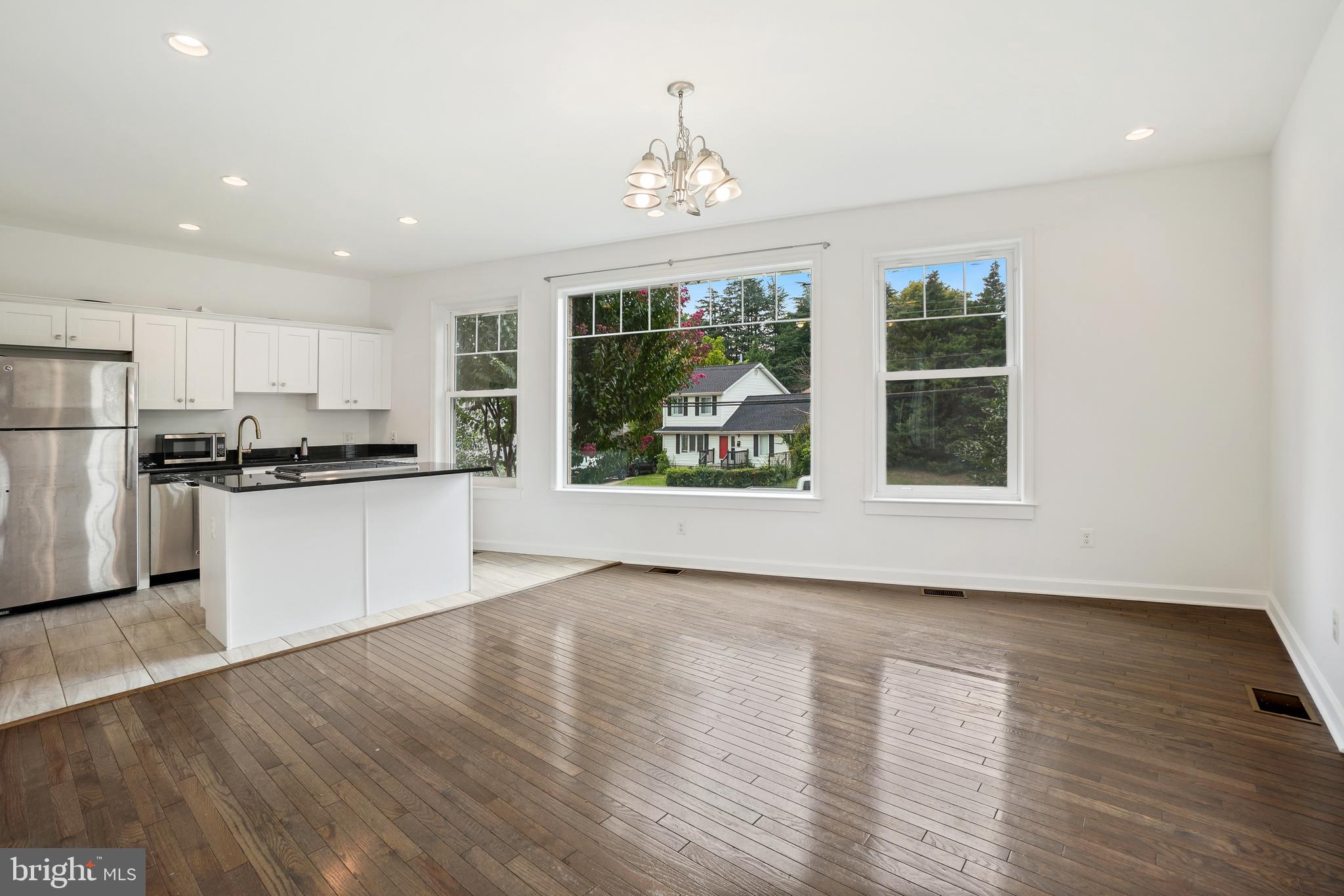 3114 19th Street South Arlington, VA 22204 - Photo 9 of 31 a view of an empty room with wooden floor and a window