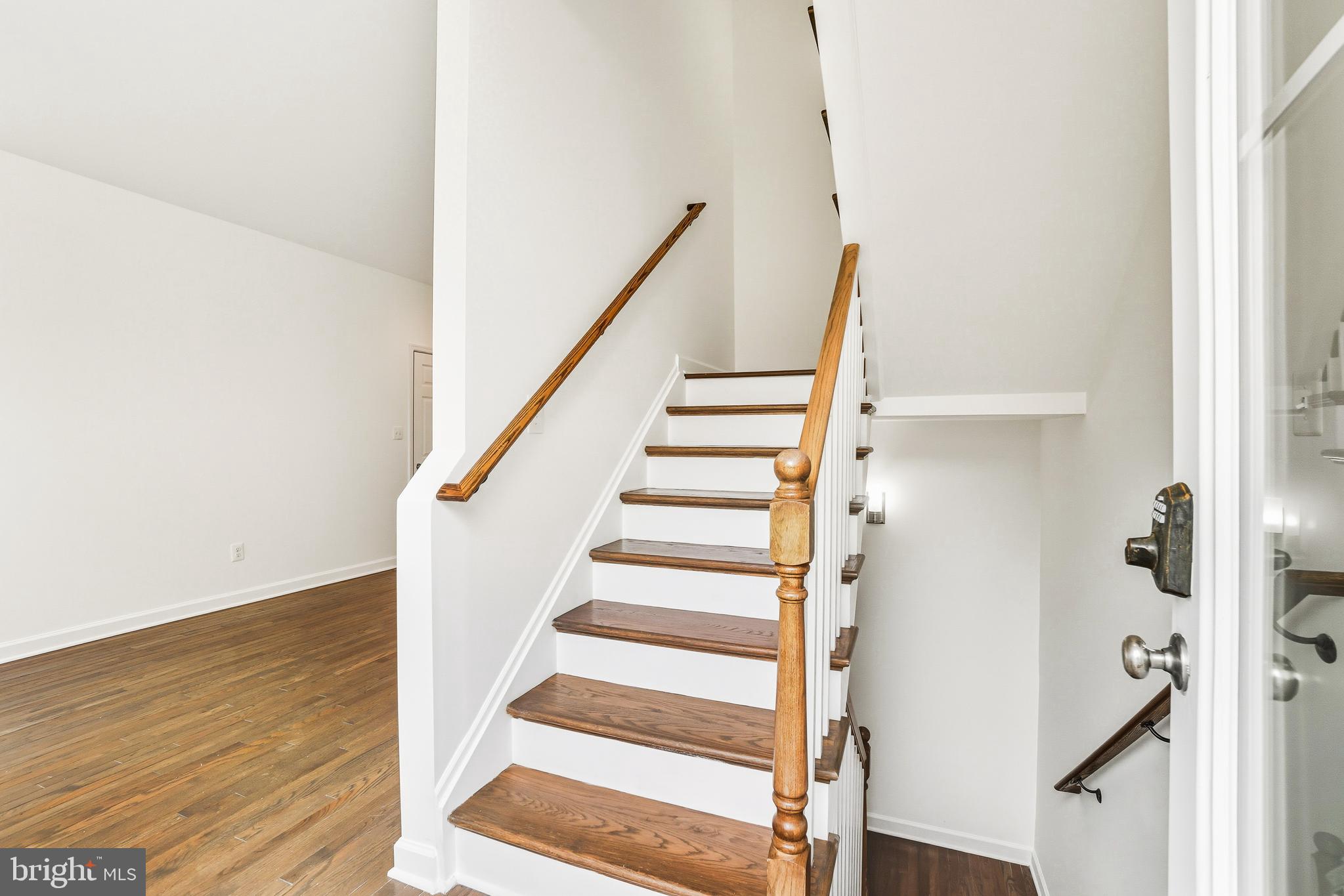 3114 19th Street South Arlington, VA 22204 - Photo 10 of 31 a view of staircase with wooden floor and white walls