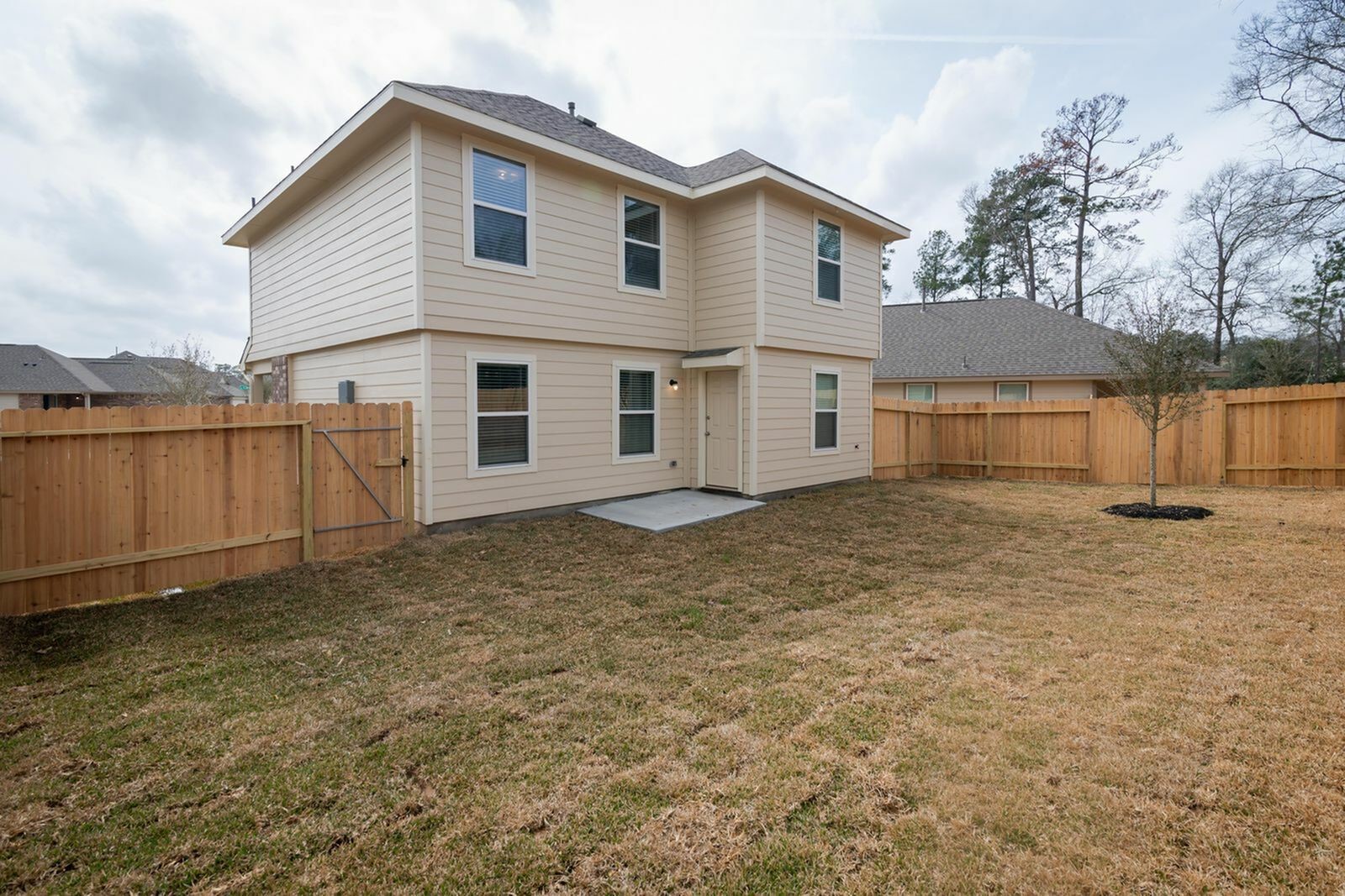3205 Chunk Drive Conroe, TX 77301 - Photo 2 of 18 a view of a house with a backyard