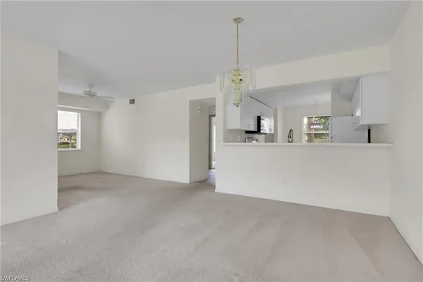 a view of a kitchen with a sink and cabinet