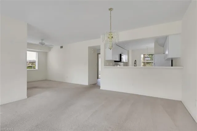 a view of a kitchen with a sink and cabinet