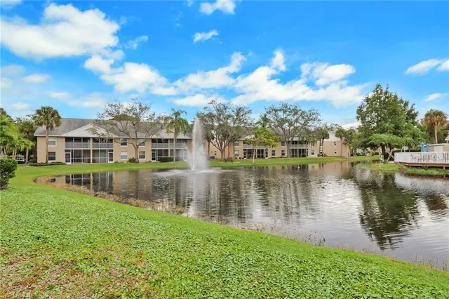 a view of a lake with a house in the background