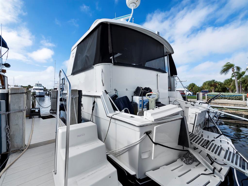 2800 Harbourside Drive, Unit E06 Longboat Key, FL 34228 - Photo 13 of 55 a view of a chairs and tables in patio