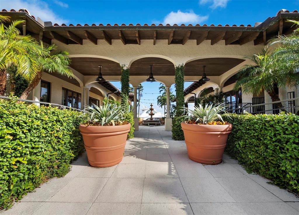 2800 Harbourside Drive, Unit E06 Longboat Key, FL 34228 - Photo 25 of 55 a view of a patio with table and chairs