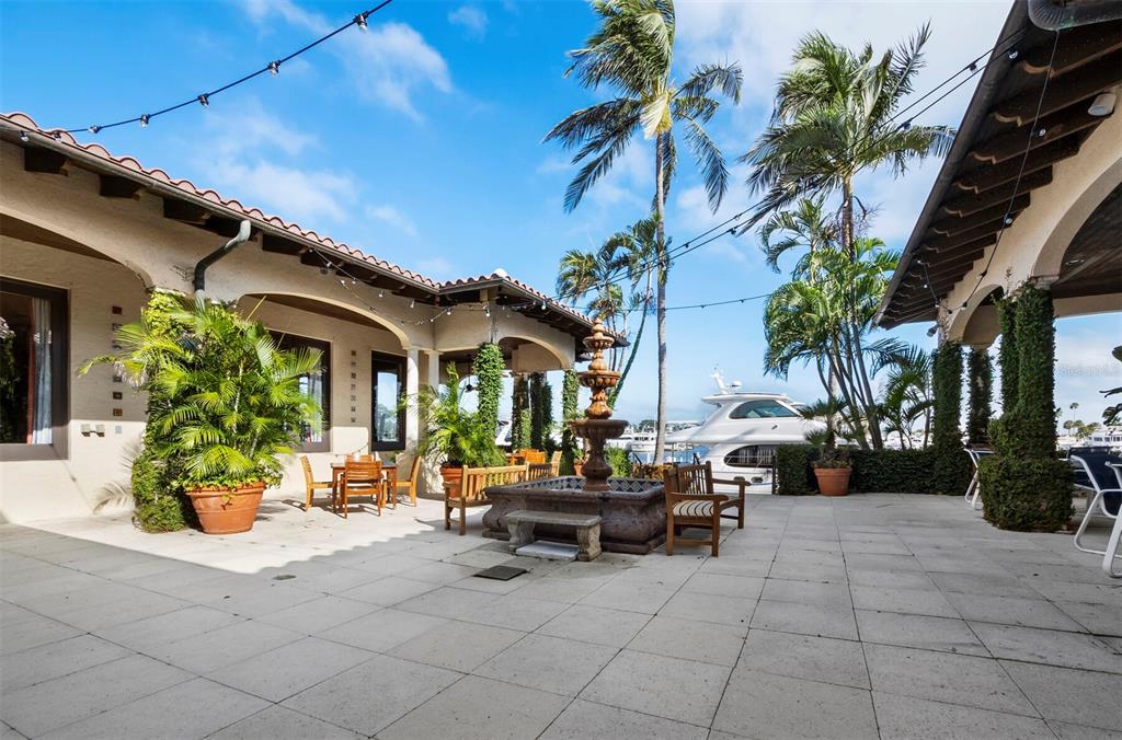 2800 Harbourside Drive, Unit E06 Longboat Key, FL 34228 - Photo 27 of 55 a view of a patio with couches and a potted plant