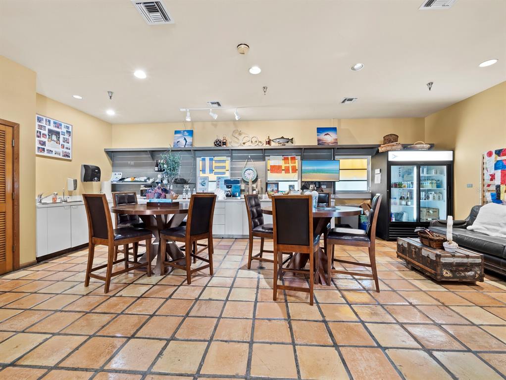 2800 Harbourside Drive, Unit E06 Longboat Key, FL 34228 - Photo 31 of 55 a view of a dining area with furniture