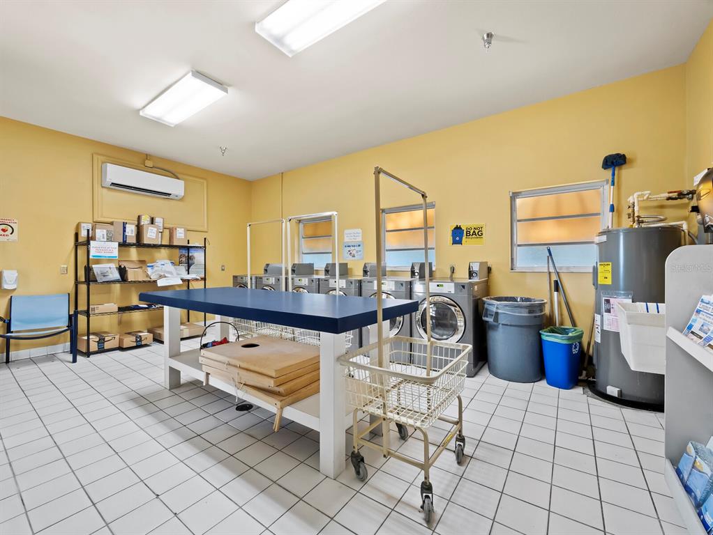 2800 Harbourside Drive, Unit E06 Longboat Key, FL 34228 - Photo 33 of 55 a living room with lots of furniture and decor