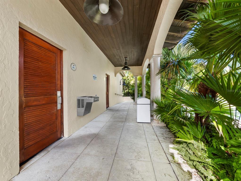 2800 Harbourside Drive, Unit E06 Longboat Key, FL 34228 - Photo 35 of 55 a view of a pathway along with potted plants
