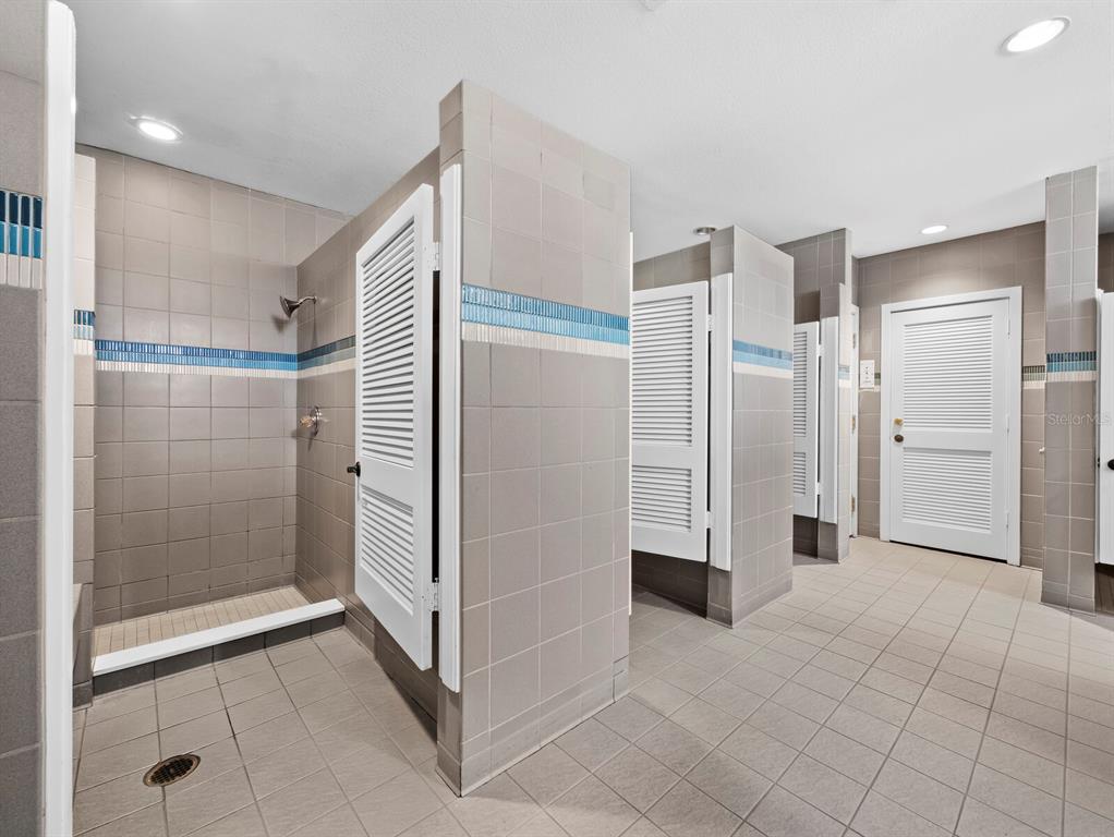2800 Harbourside Drive, Unit E06 Longboat Key, FL 34228 - Photo 36 of 55 a bathroom with a shower and closet