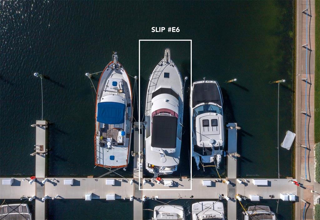 2800 Harbourside Drive, Unit E06 Longboat Key, FL 34228 - Photo 5 of 55 a front view of a house with a residential apartment building