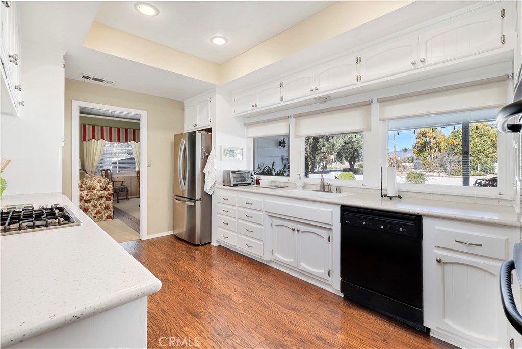 27454 Hemet Street Hemet, CA 92544 - Photo 11 of 51 a kitchen with a stove a refrigerator and a sink