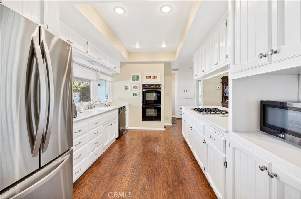 27454 Hemet Street Hemet, CA 92544 - Photo 12 of 51 a large kitchen with stainless steel appliances a refrigerator and a stove top oven