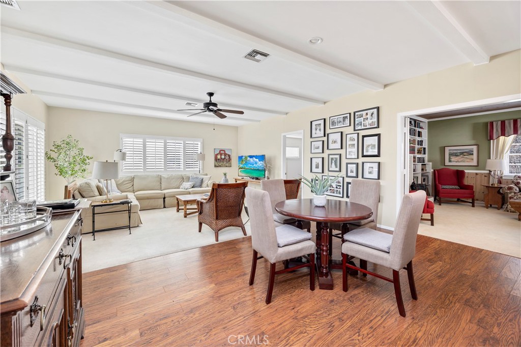 27454 Hemet Street Hemet, CA 92544 - Photo 14 of 51 a view of a dining room with furniture and wooden floor