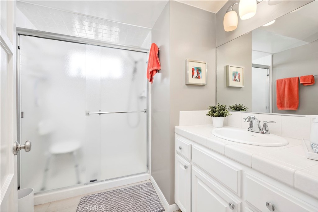 27454 Hemet Street Hemet, CA 92544 - Photo 28 of 51 a bathroom with a sink vanity and a mirror