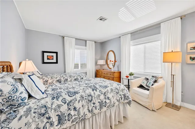 a bedroom with bed and window