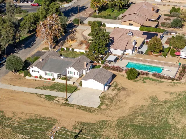 an aerial view of residential houses with outdoor space