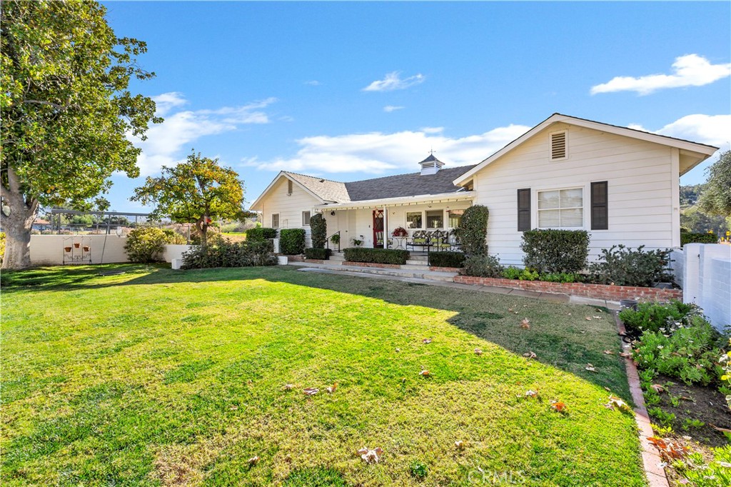 27454 Hemet Street Hemet, CA 92544 - Photo 5 of 51 a view of a house with pool and a garden