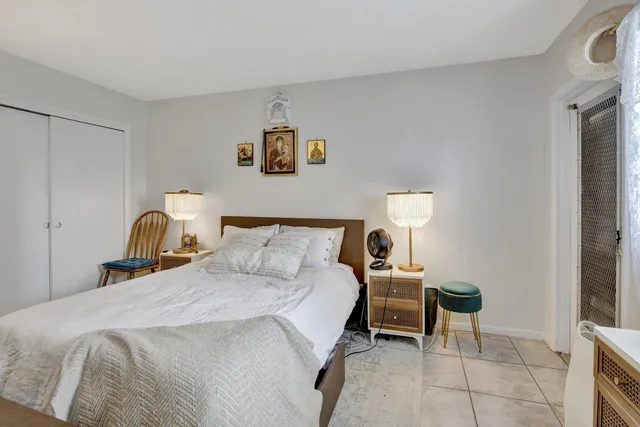 a bed room with a bed and a television