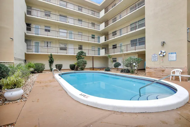 a view of a swimming pool and outdoor space