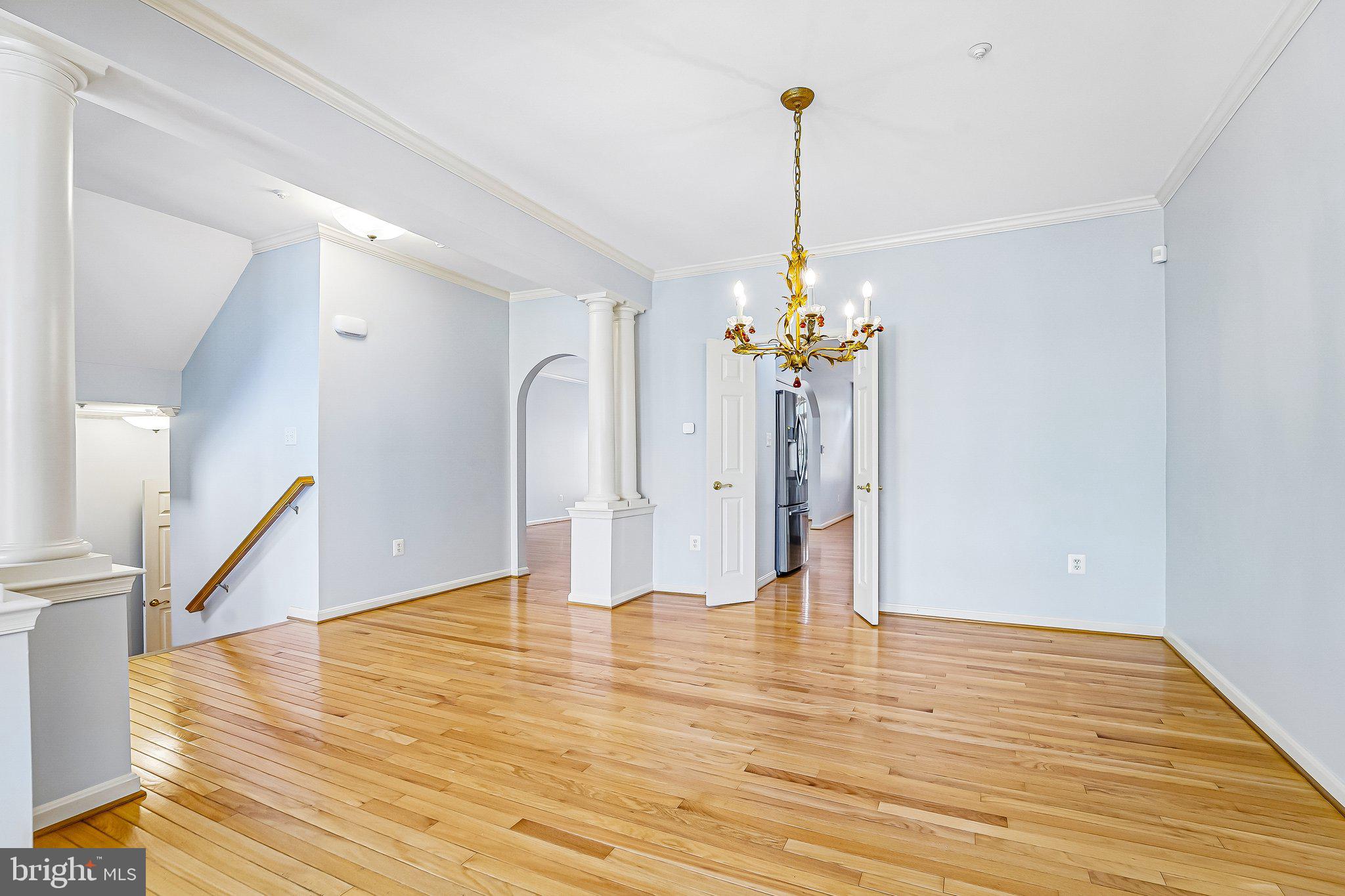 2422 Rippling Brook Road Frederick, MD 21701 - Photo 4 of 35 a view of a room with wooden floor and a chandelier