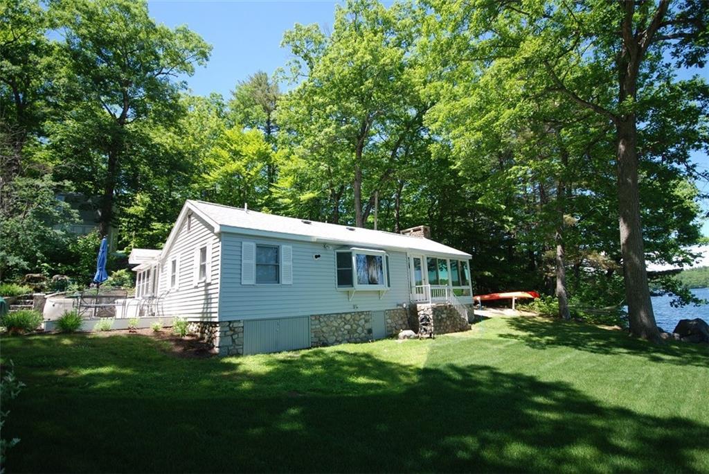 711 Anderson Road Sebago, ME 04029 - Photo 2 of 17 View of house from the beach.